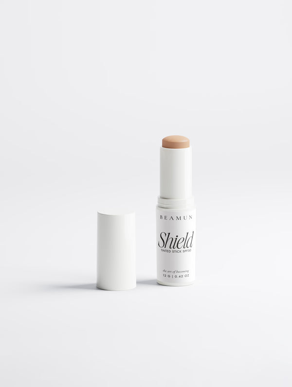 Shield stick with the cap off, showing the tinted balm