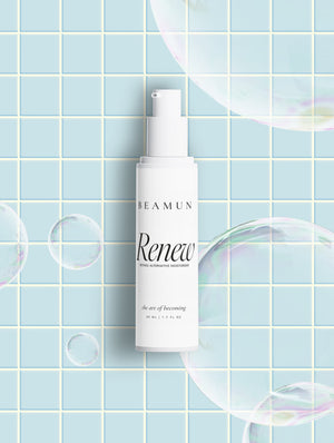 Renew bottle on pale blue tiles among soap bubbles