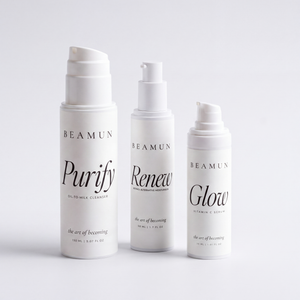 The three Becoming Ritual bottles together: cleanser, serum and moisturiser