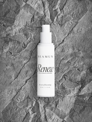 Renew bottle resting on grey stone